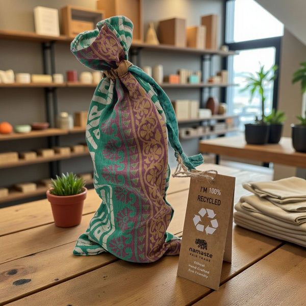 Recycled fabric bag with a tag on a wooden table in a store setting