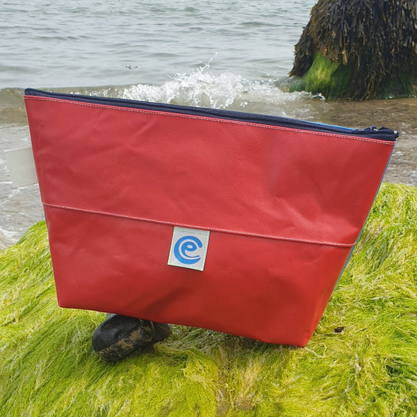 Eco friendly wash bag in red with a zip closure by Earth Conscious